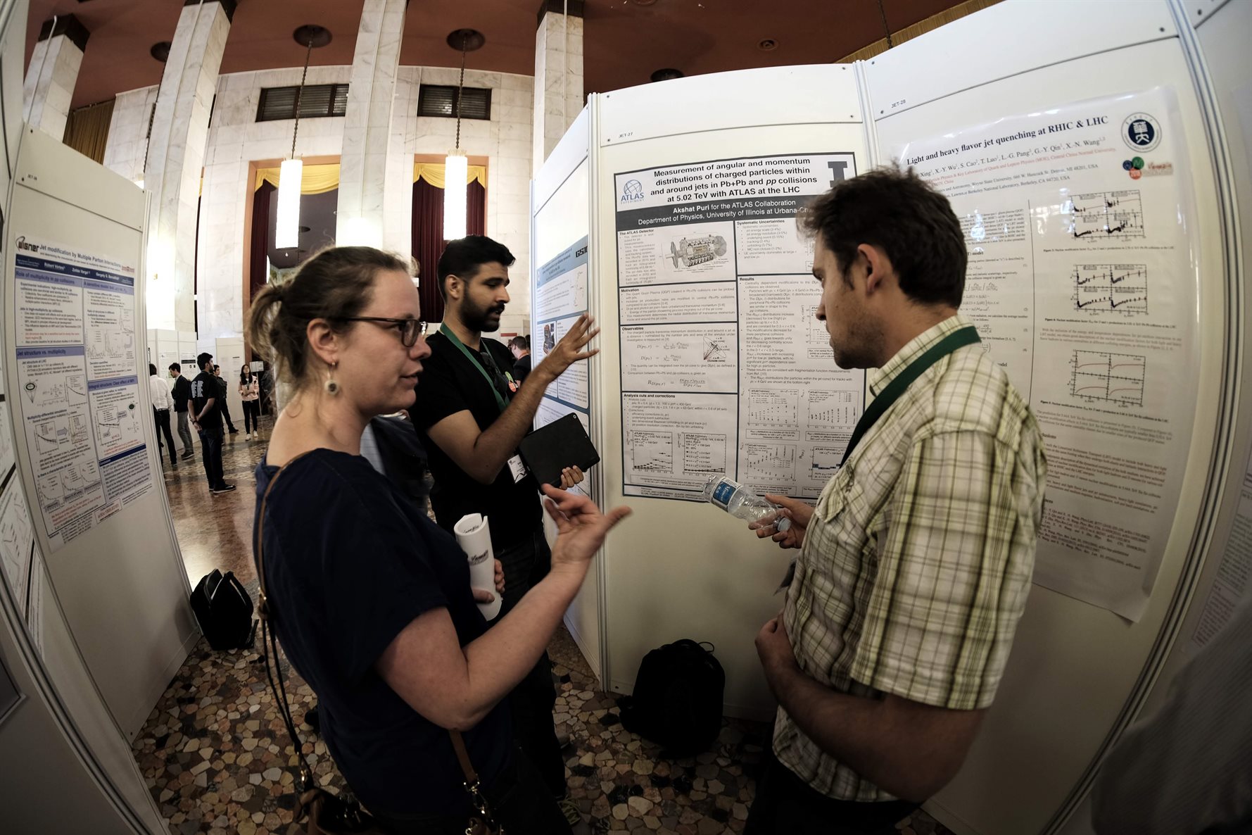 Figure 4: Graduate Student Akshat Puri presenting results from his analysis in a poster session at Quark Matter 2018 hosted in Venice, Italy