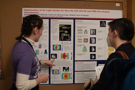 Illinois Physics student Samantha Lund presents her poster at CUWiP 2023. Photo by Nicole Terzian for Illinois Physics